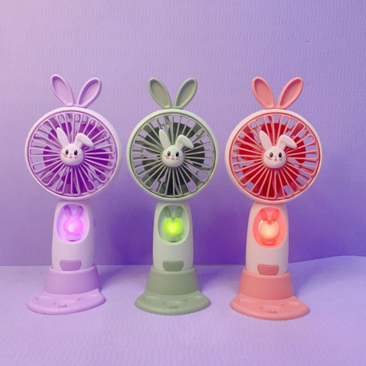 Kipas Angin Genggam Tangan Karakter Bunny Dengan LED + Holder Penyangga HP / Handy Mini Fan Portable Rechargeable Elektrik Motif Kelinci Lucu Travel Size Travelling Outdoor Konser Piknik Pantai Jogging CFD Luar Ruangan Make Up Skincare Multifungsi